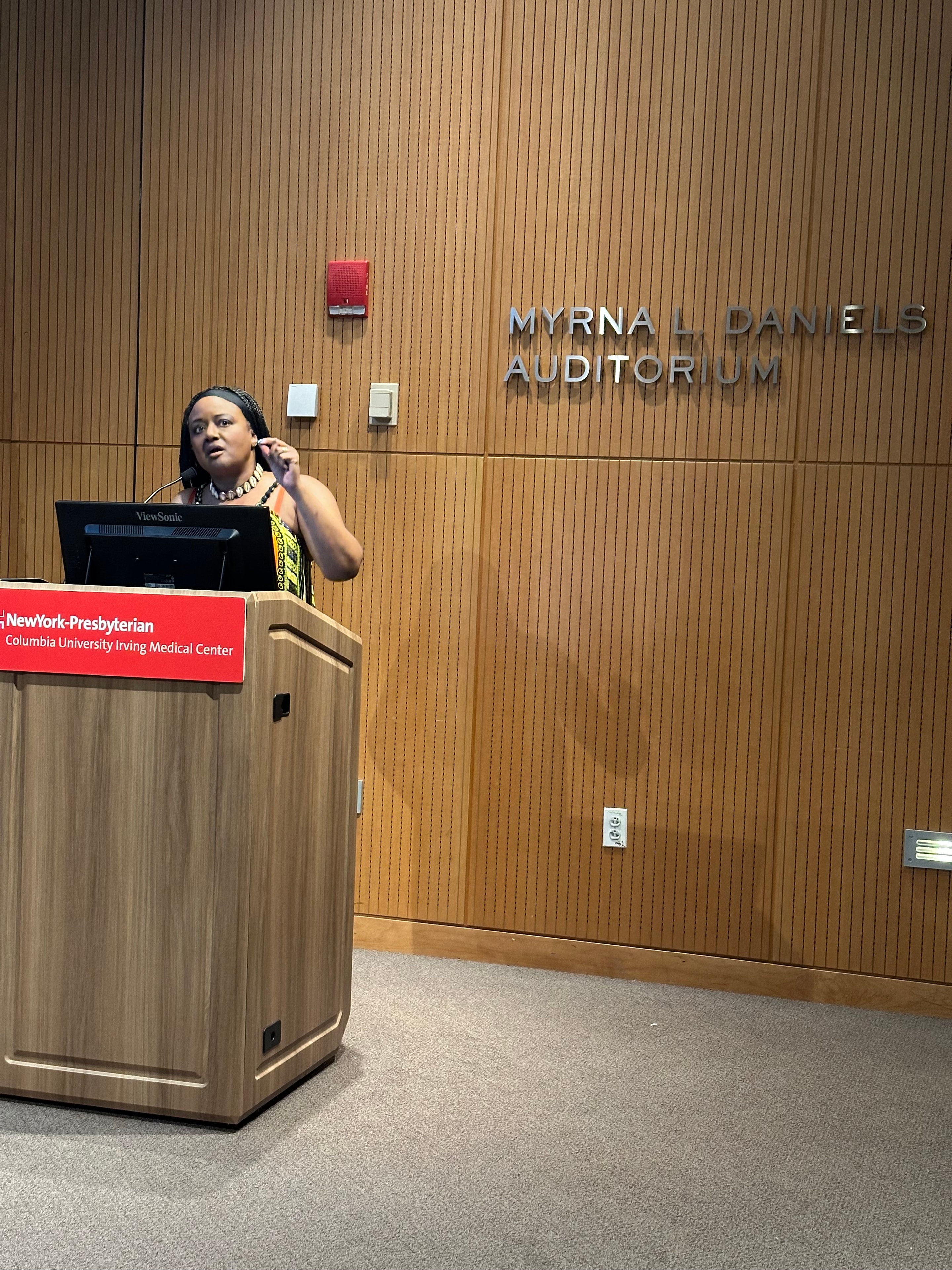 Elizabeth June speaking at Columbia University